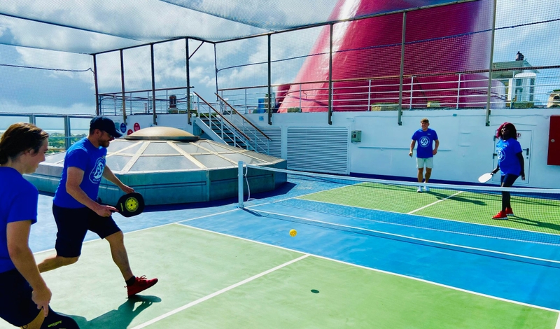 Carnival Conquest Team Plays Pickleball on Ship's New Court