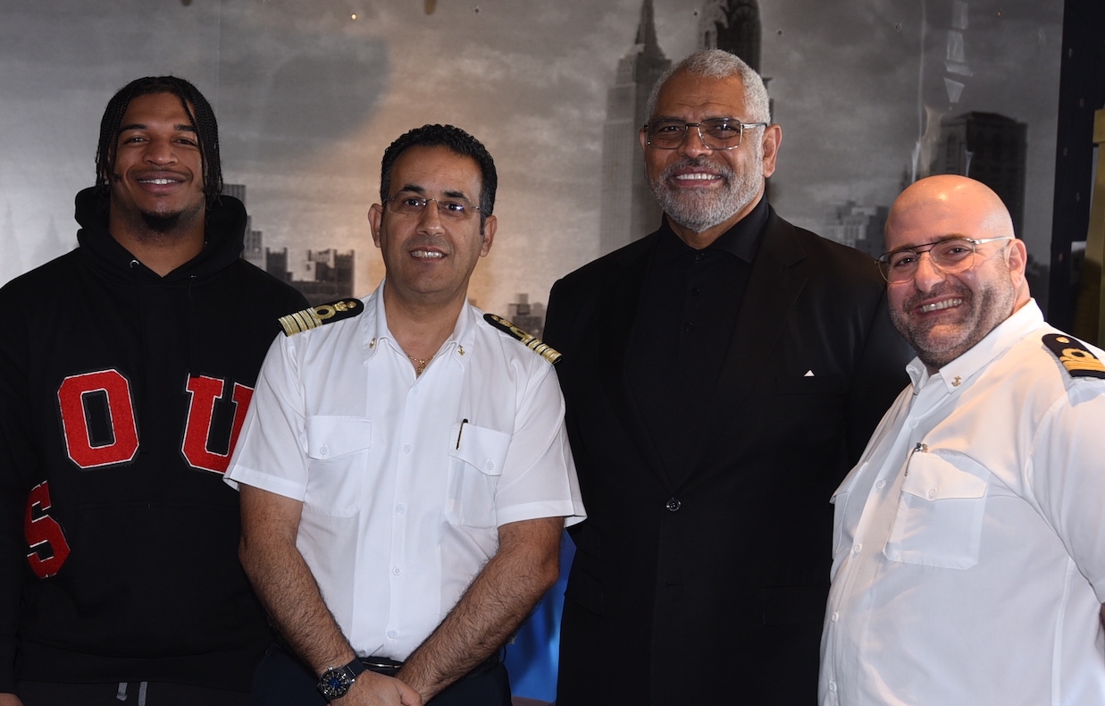 Ja'Marr Chase and Arnold Donald are welcomes aboard by Carnival Valor's crew