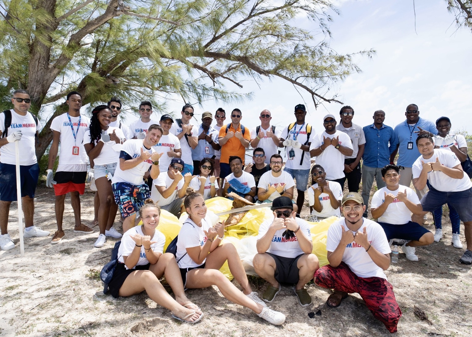 Carnival team members volunteer during a beach clean-up