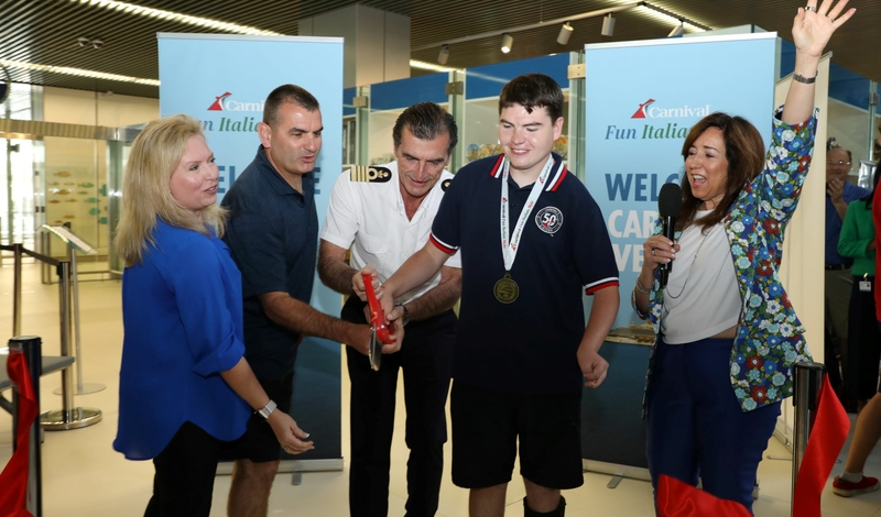 Carnival President Christine Duffy is joined by Captain Claudio Cupisti and the first family to embark on Carnival Venezia