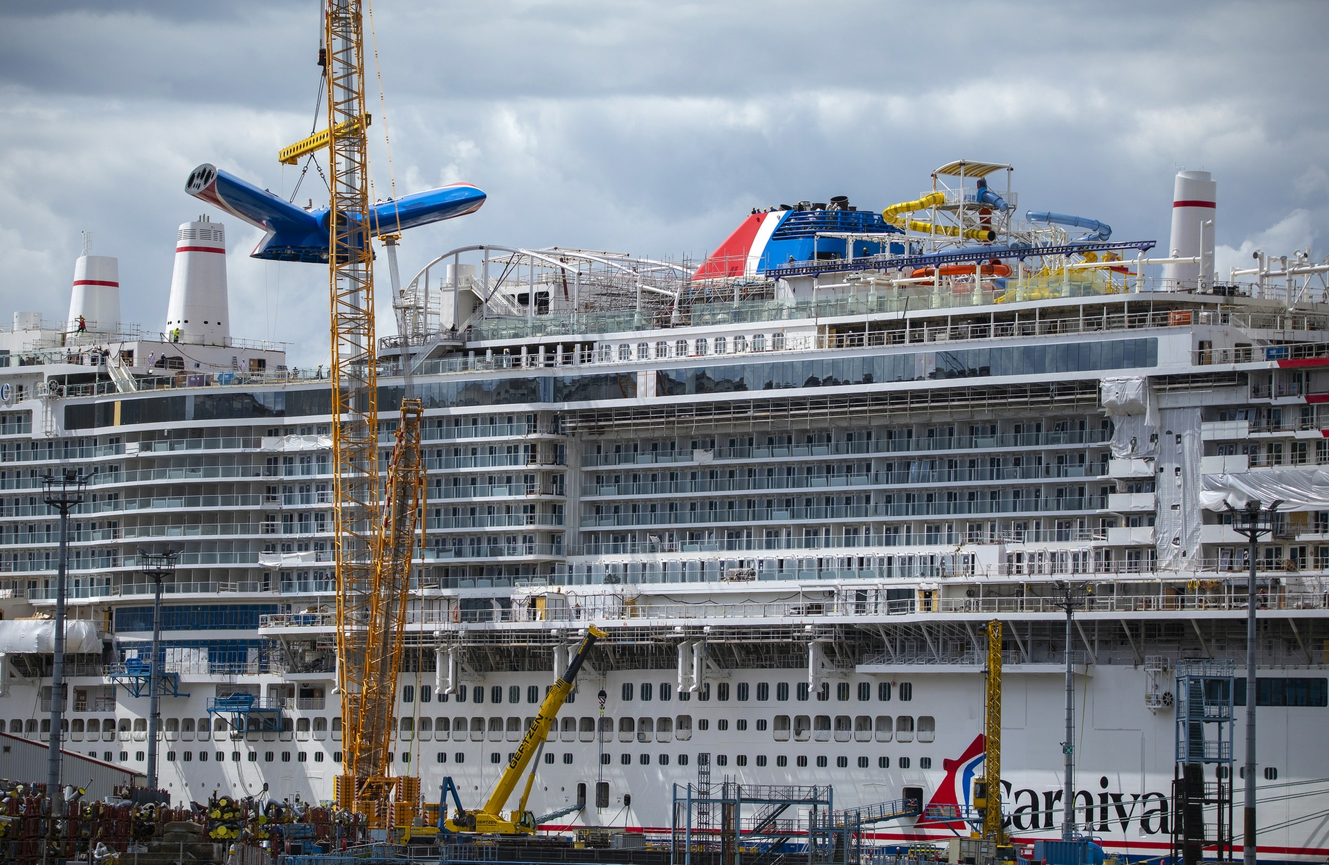 Carnival Jubilee is docked alongside the shipyard's outfitting pier in Papenburg, Germany and is set to welcome guests from Galveston in December-min