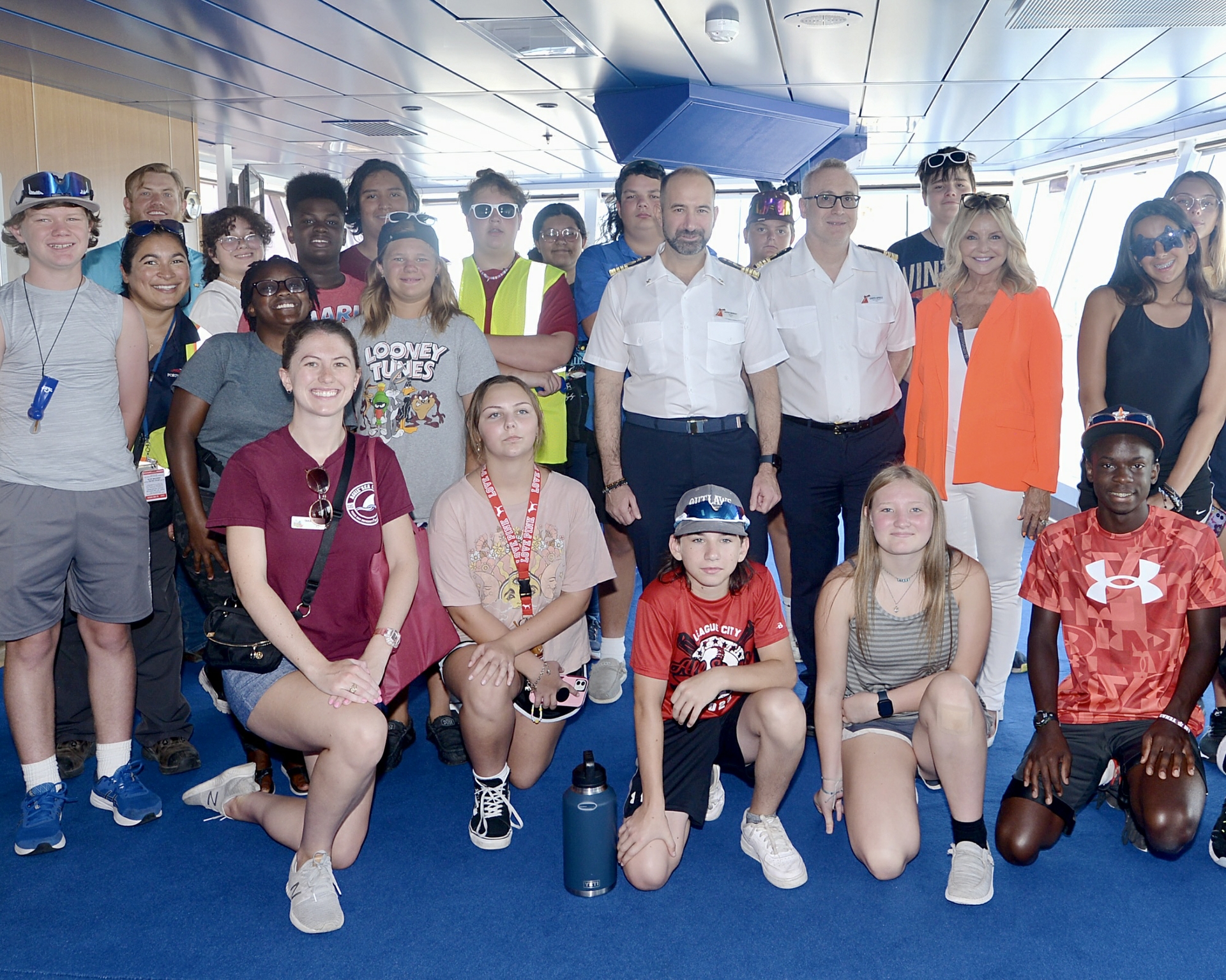 Galveston students pose for photo in bridge on Carnival Breeze