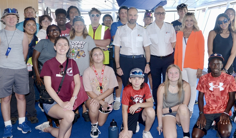Galveston students pose for photo in bridge on Carnival Breeze