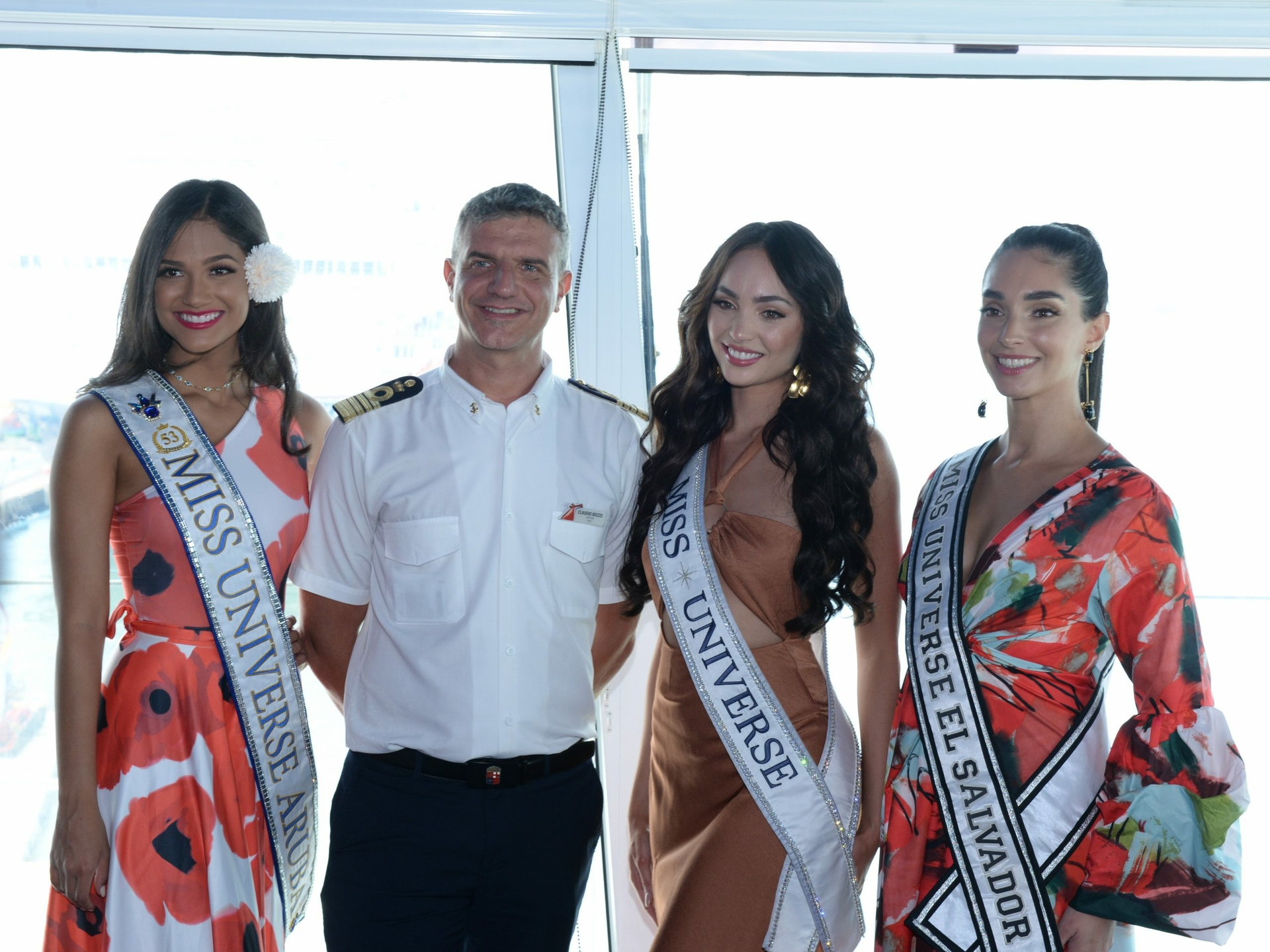 Miss Universe Titleholders pose with Captain Claudio Bozzo-min
