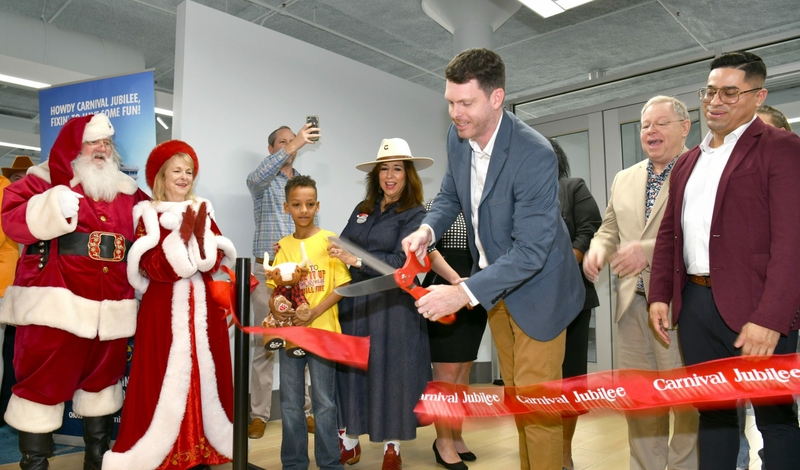 Travel advisors from Vacations to Go cut ribbon for Carnival Jubilee's first sailing