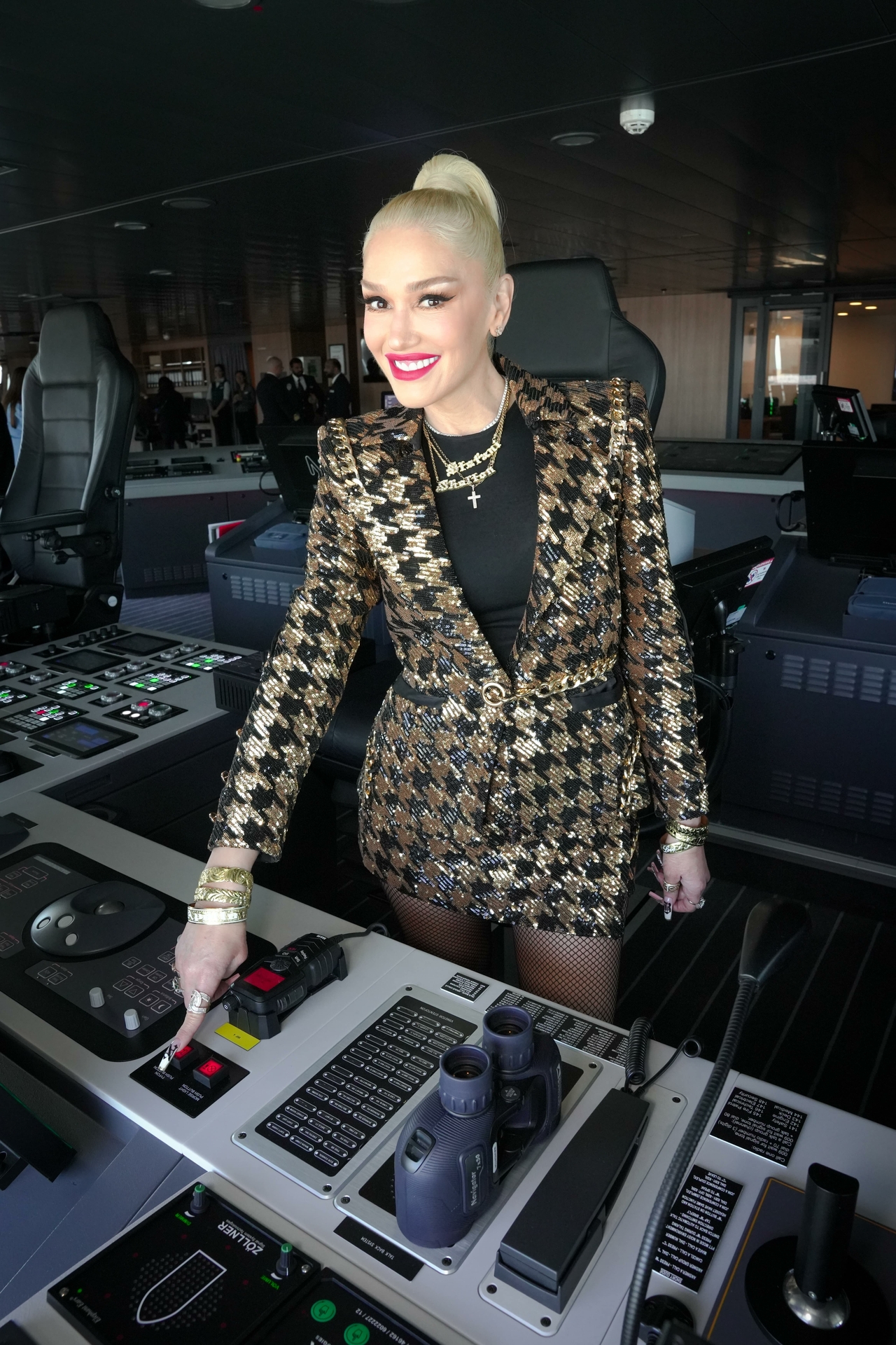 Gwen Stefani tours the bridge of Carnival Jubilee, and pushes the button on the iconic Carnival funnel horn