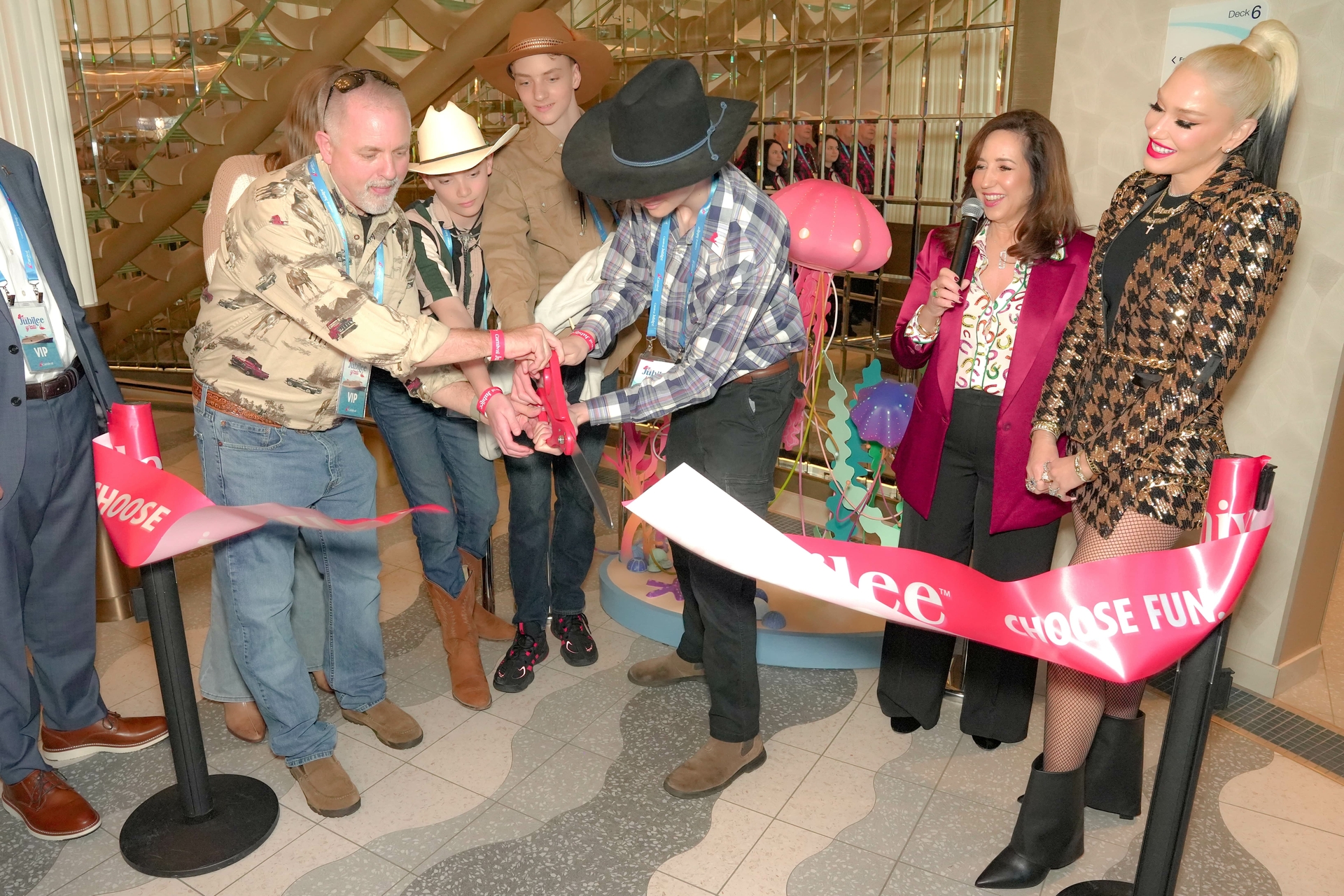 Ty Crowninshield cuts a ceremonial ribbon on a scultupre inspired by artwork he created when he was a patient at St. Jude's Children's Hospital