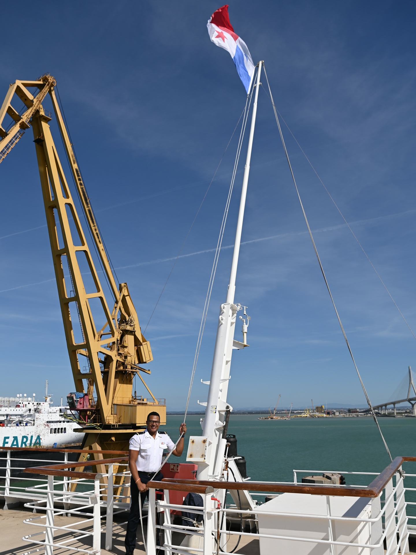 Carnival Firenze team member from Panama raises Panamanian flag