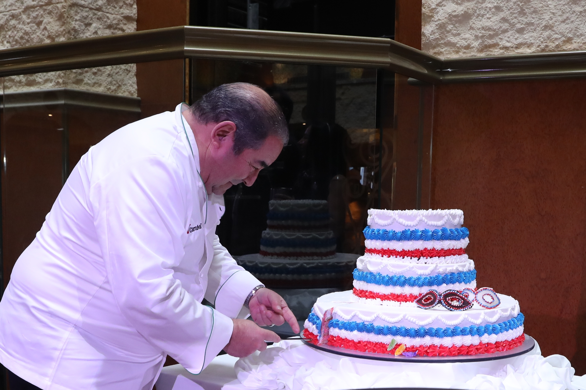 Emeril Lagasse cuts special anniversary cake during celebration