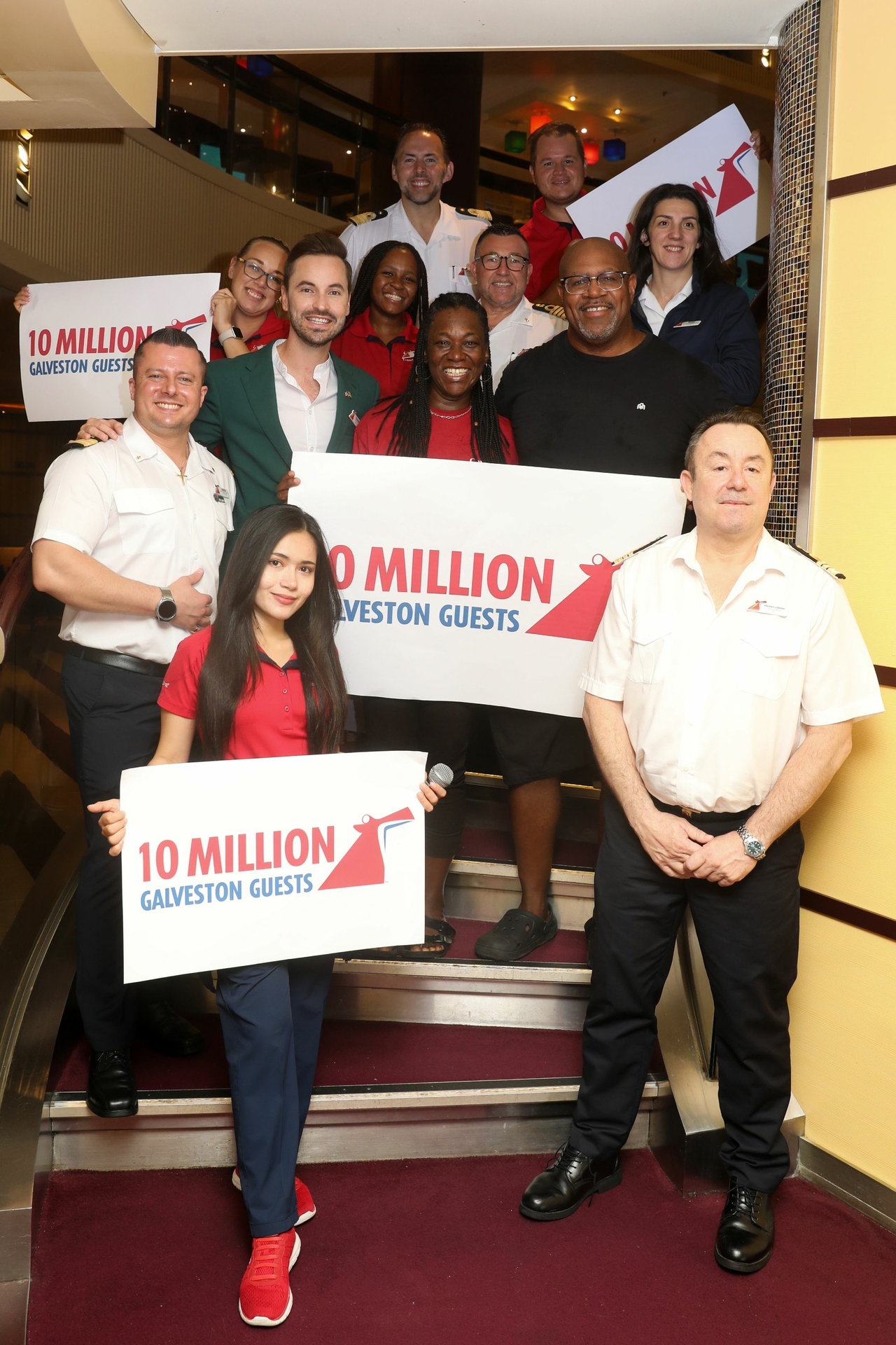 Marsha Taulton, Carnival's 10 millionth guest from Galveston, and husband Paul Taulton celebrate with Carnival Breeze team