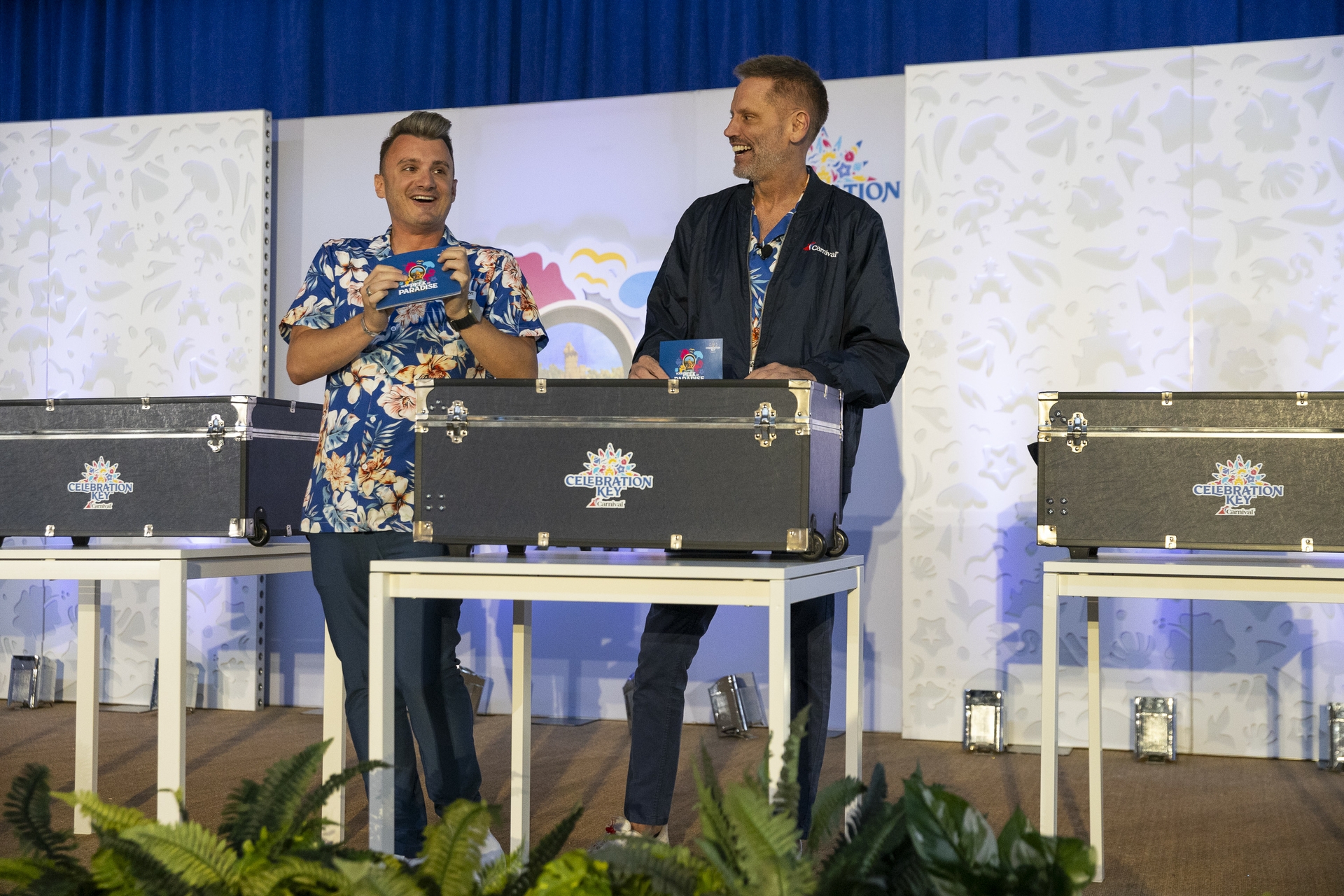 Cruise Director James Love and Senior Vice President of Global Sales and Trade Marketing Adolfo Perez get ready to announce winners