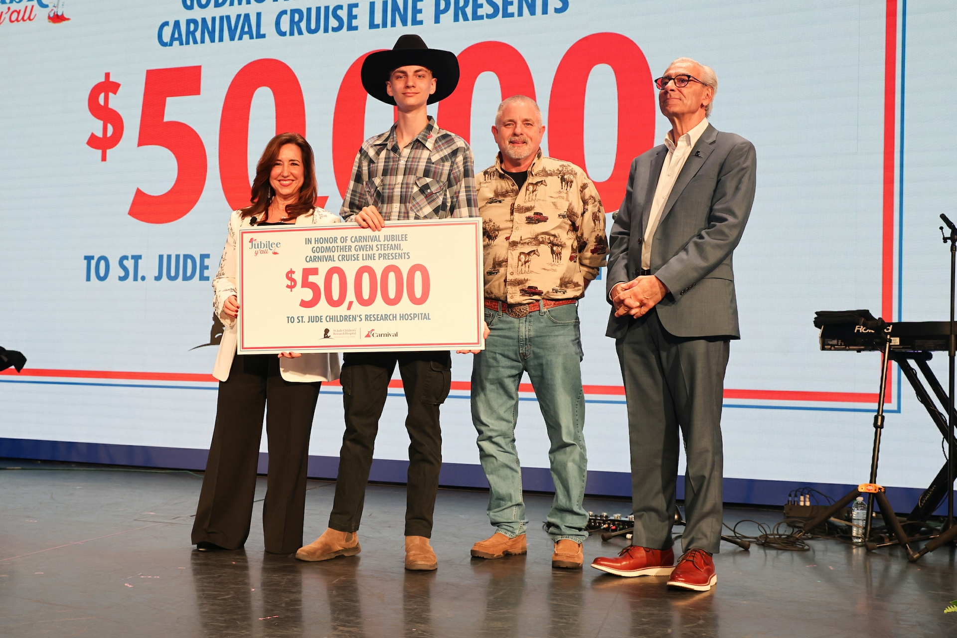 Carnivals President Christine Duffy pictured with Richard C. Shadyac Jr. ALSAC President and CEO along with St. Jude patient Ty diagnosed with retinoblastoma and his dad