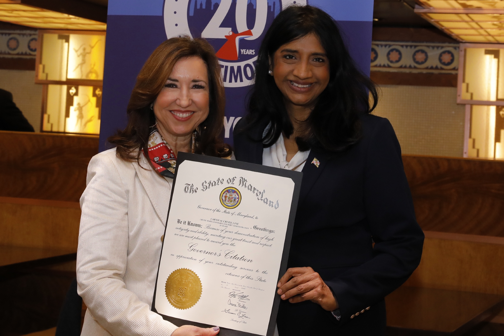 Maryland Lt. Gov. Aruna Miller presents Carnival President Christine Duffy with a special Governors Citation from the state