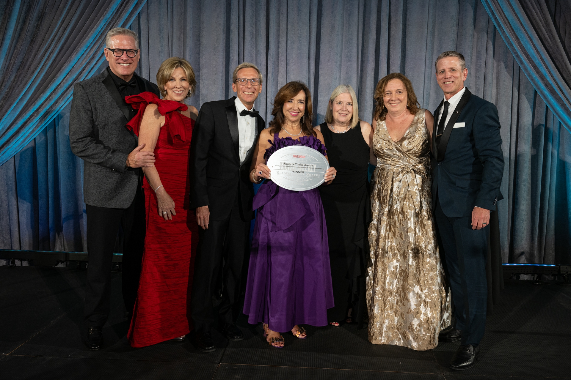 Carnival Cruise Line President Christine Duffy joined by other leadership exectuives to accept award at Travel Weekly Awards Ceremony