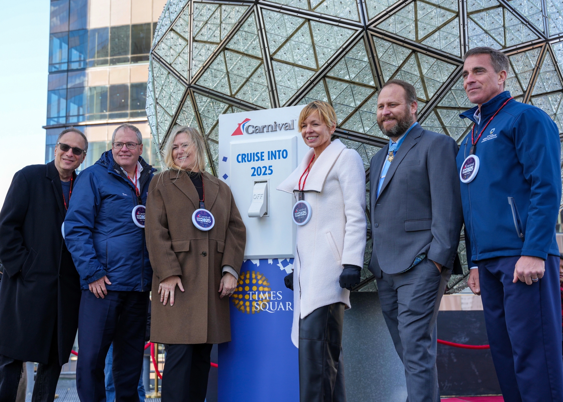 Carnival and military hero guests help light the iconic New Year’s Eve Ball