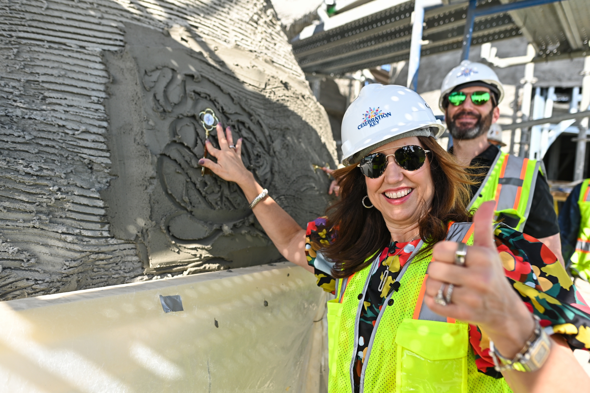 Carnival Cruise Line President Christine Duffy and Carnival Corp. CEO Josh Weinstein lay commemorative keys in the Celebration Key Suncastle