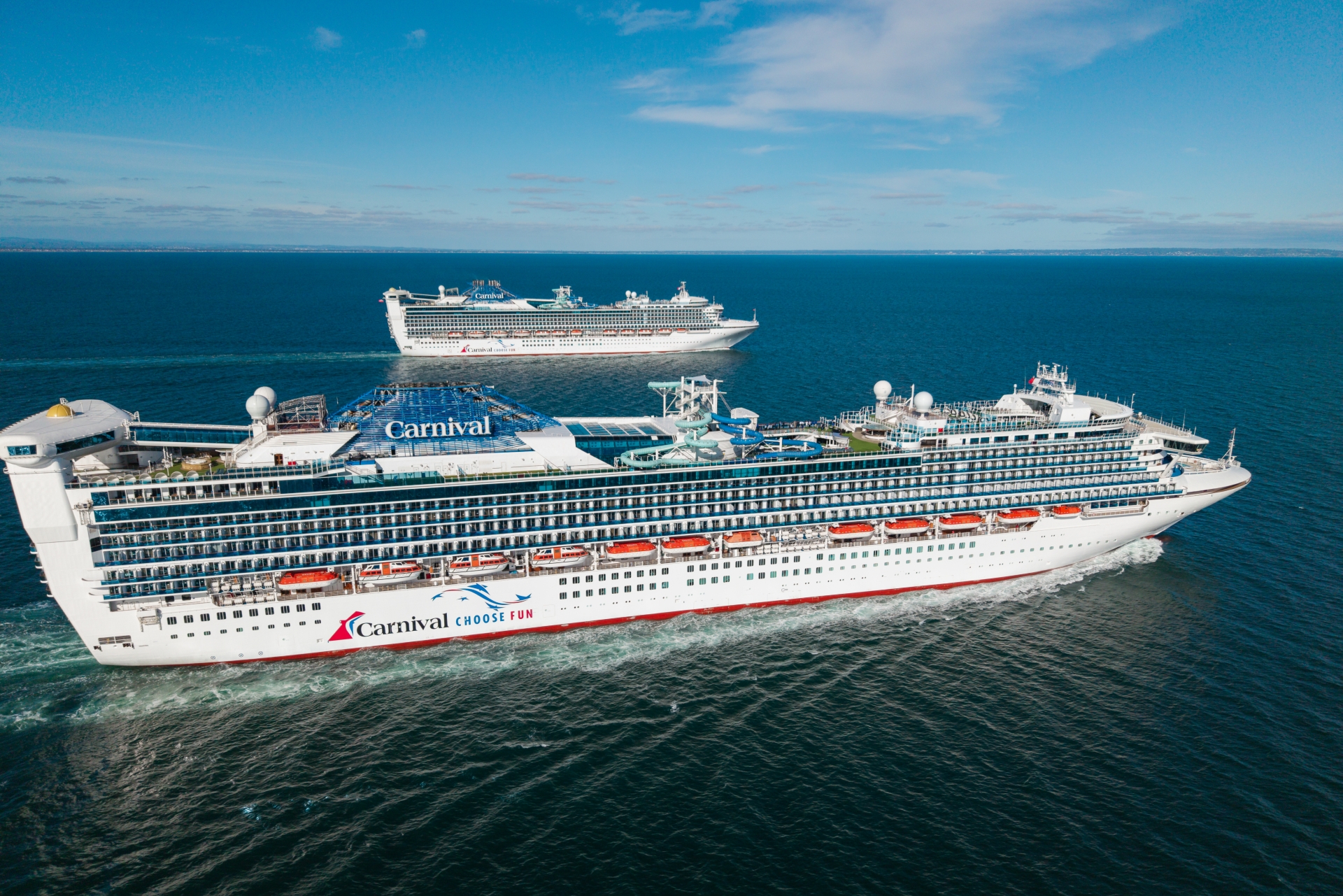 Carnival Adventure and Carnival Encounter sail side by side