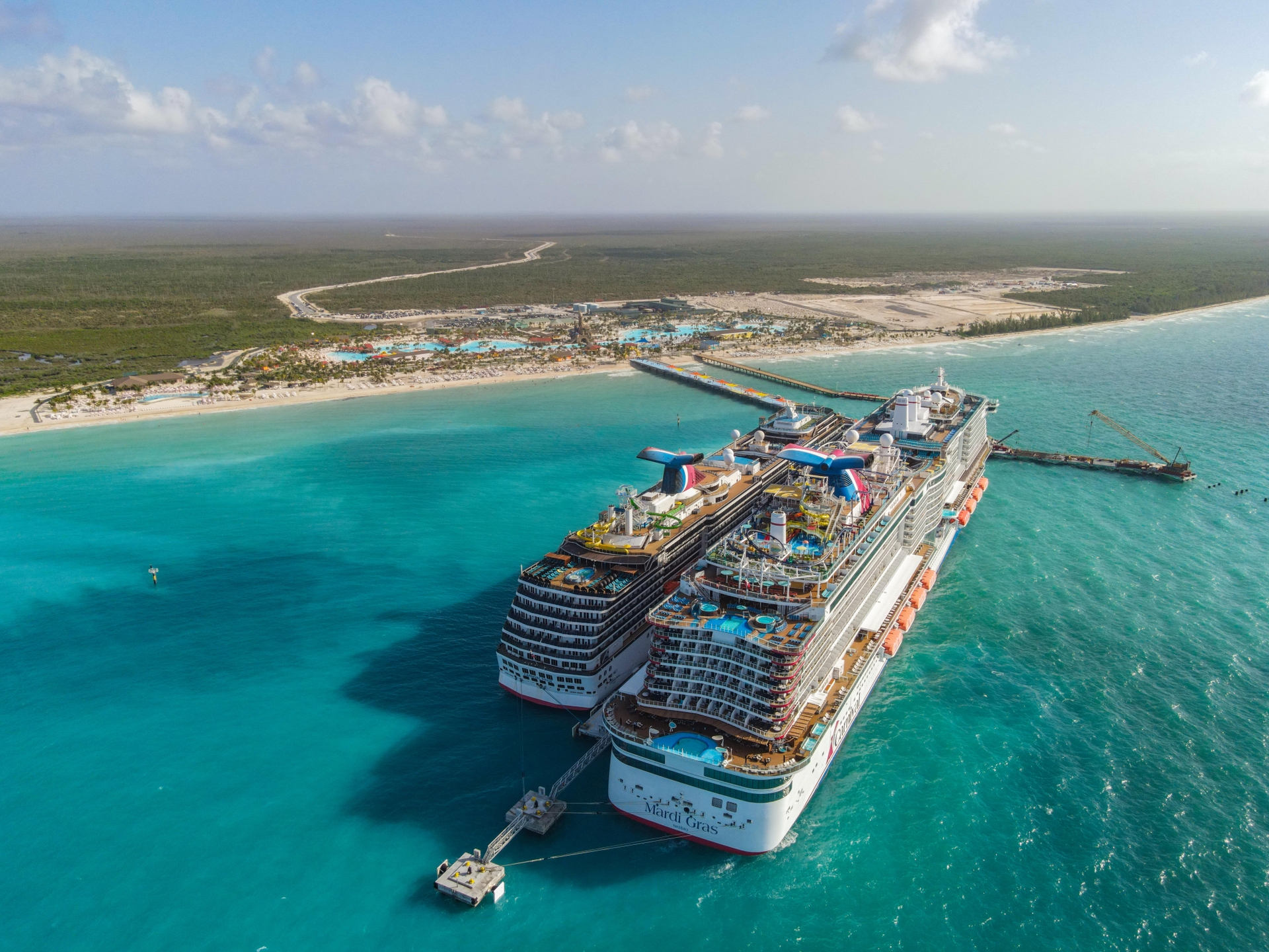 Mardi Gras and Carnival Pride docked at Celebration Key