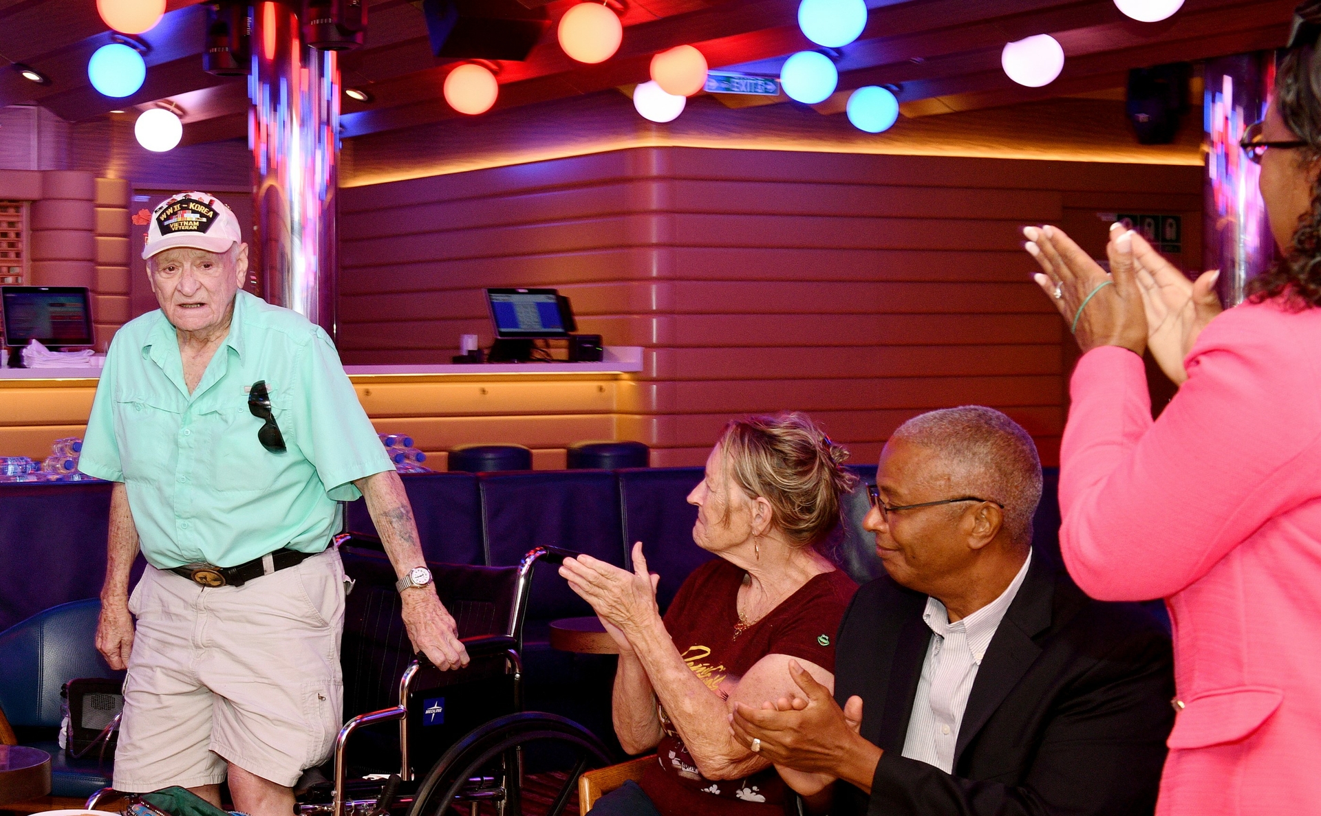 Attendees applaud veteran of both World War II and the Korean War.