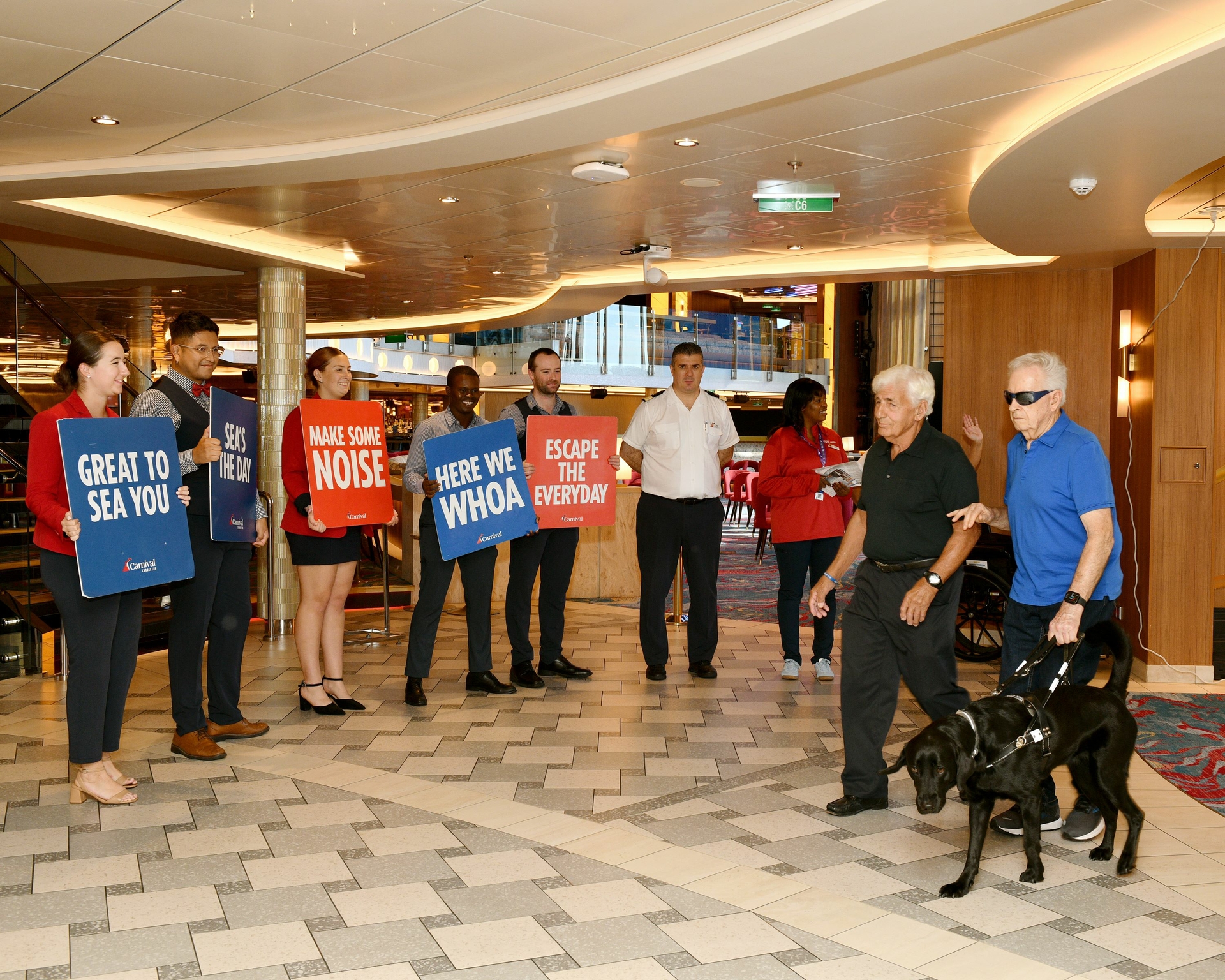 Mardi Gras crew welcome veterans aboard for celebration.