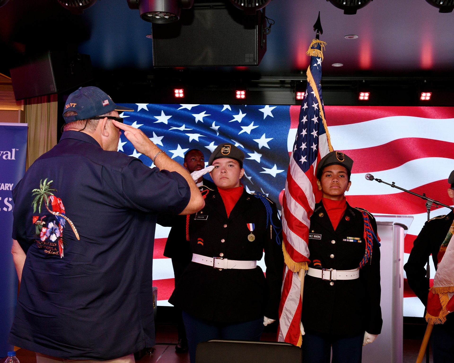 Veteran salutes East River Falcon Battalion Color Guard.