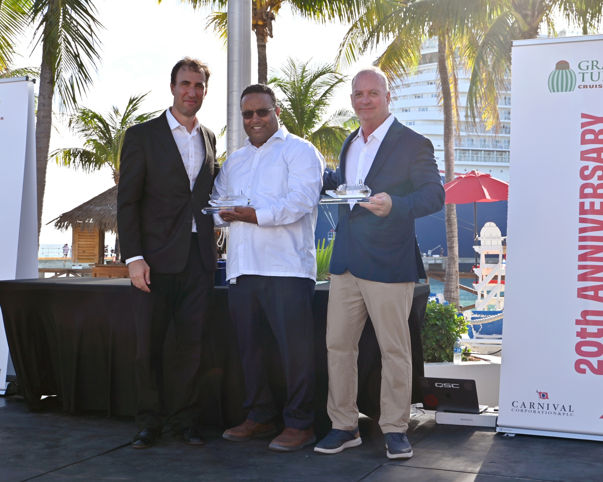Damian Rudich presenting ship model gifts to Finance and Administration Manager South Base, Grand Turk Vishal Kakkanad and Director of Destination Operations of Grand Turk John Huber