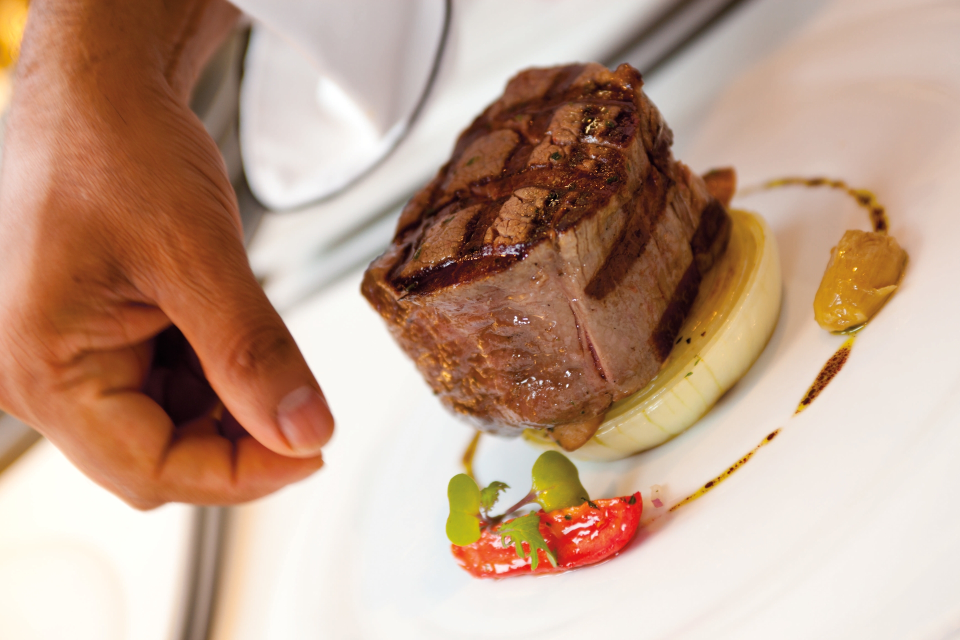 Carnival Chef prepares Filet Mignon as part of Express Dining offering