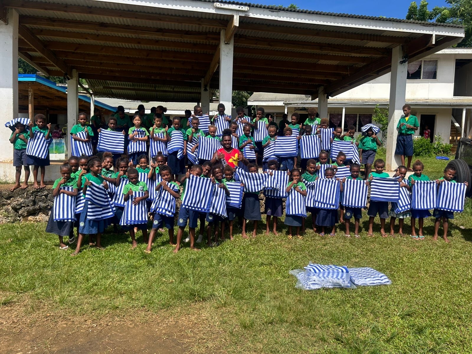 Port Vila children with towels donated by Carnival Cruise Line