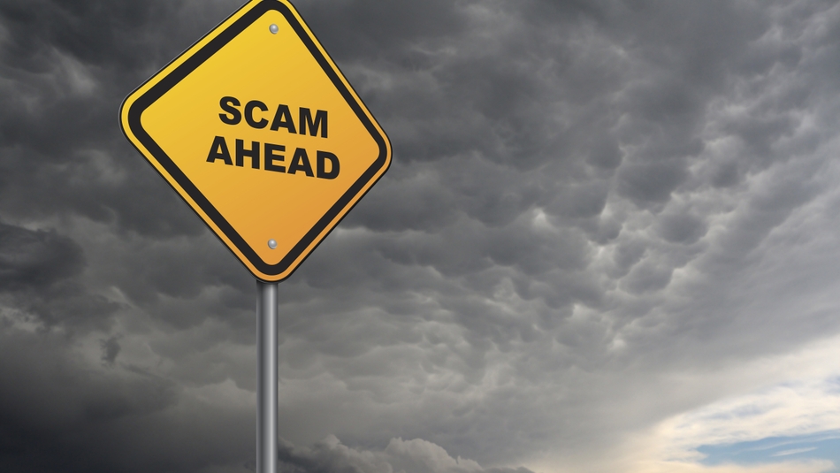 scam ahead on a road sign with storm in background