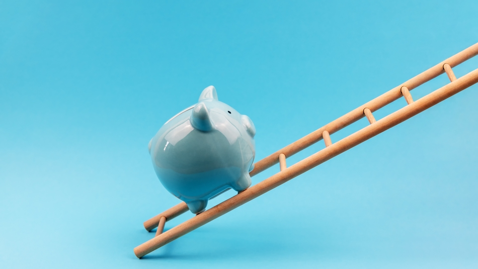 blue piggy bank climbing a ladder