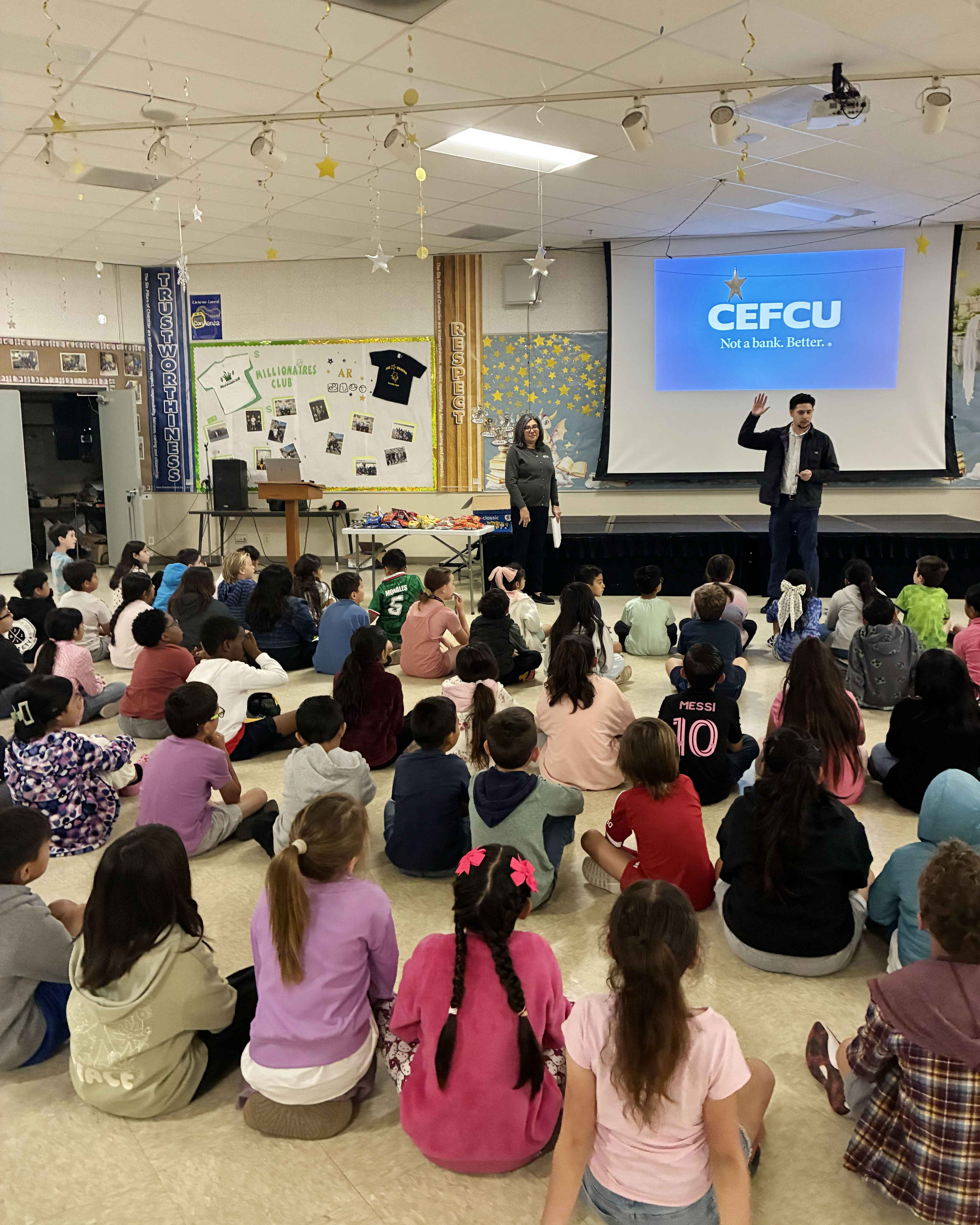 Two CEFCU team members providing a financial literacy session to second-grade students in Gilroy, CA.