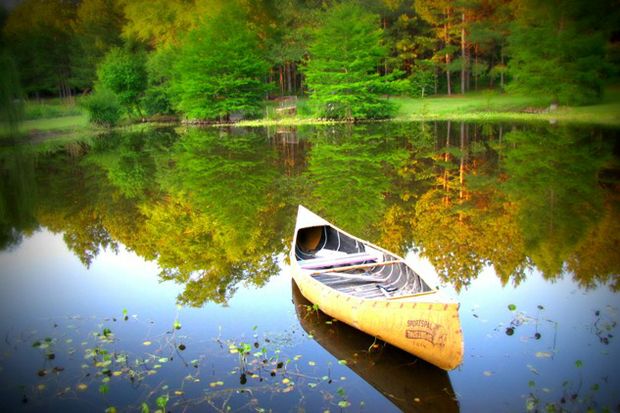 fall empty canoe waiting on lake