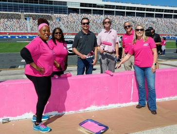 Kurt Busch Teams with Breast Cancer Survivors to Paint Pit Wall Pink at Charlotte Motor Speedway 