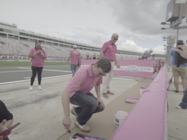 Erik Jones Teams With Breast Cancer Survivors, Paint Pit Wall Pink
