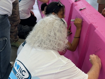 Blue Cross NC Joins Breast Cancer Survivors to Paint Pit Wall Pink