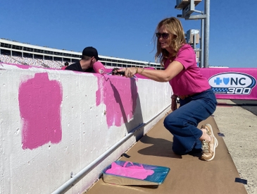 Breast Cancer Survivors, NASCAR Drivers Paint Pit Wall Pink Ahead of Blue Cross NC 300