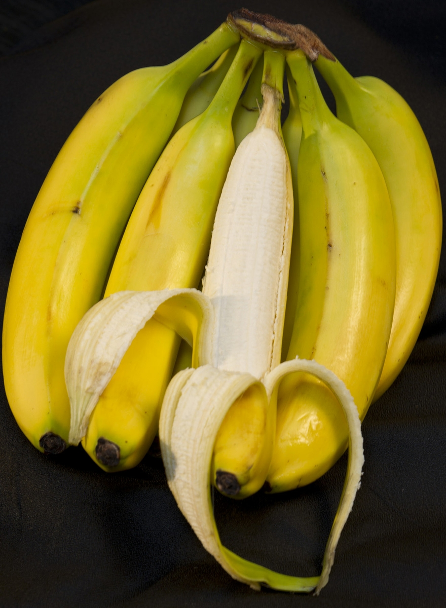 Bananas - bunch with one peeled with heart shape
