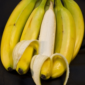 Bananas - bunch with one peeled with heart shape