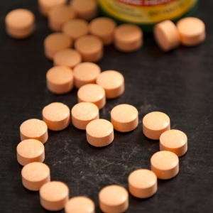Vitamin C chewable tabs in heart shape and bottle