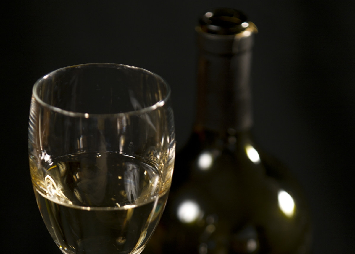 Wine - White in Glass with bottle closeup horizontal