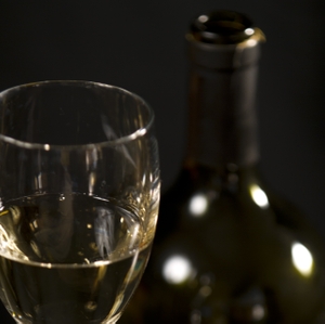 Wine - White in Glass with bottle closeup horizontal