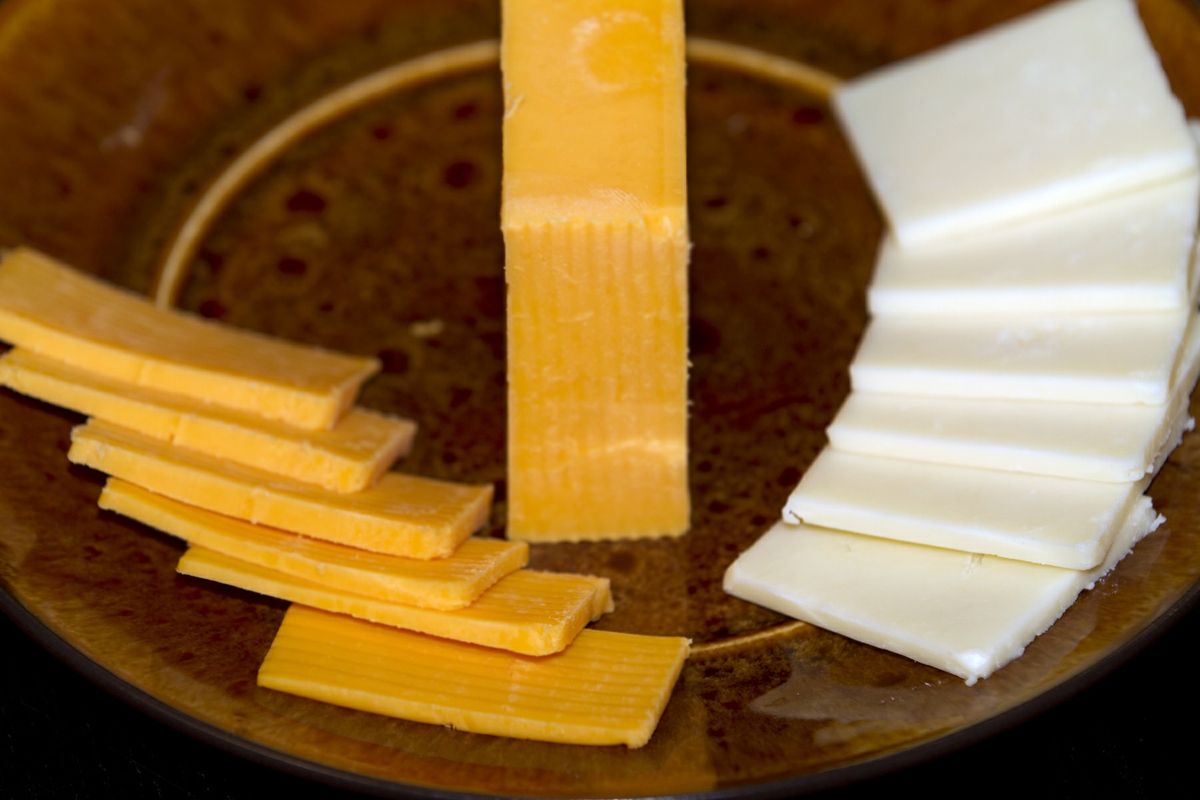 Cheese low-fat cheddar and Colby sliced close up horizontal