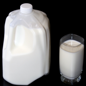 Milk LowFat in glass with full jug verticle from above