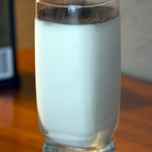 Cocoa Powder in glass of milk stirring