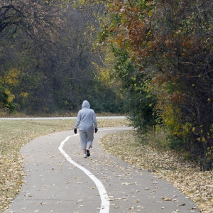 Walking - Woman - wide shot - outside track
