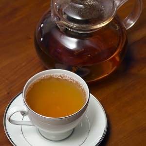 Green Tea in Cup with Tea Pot 