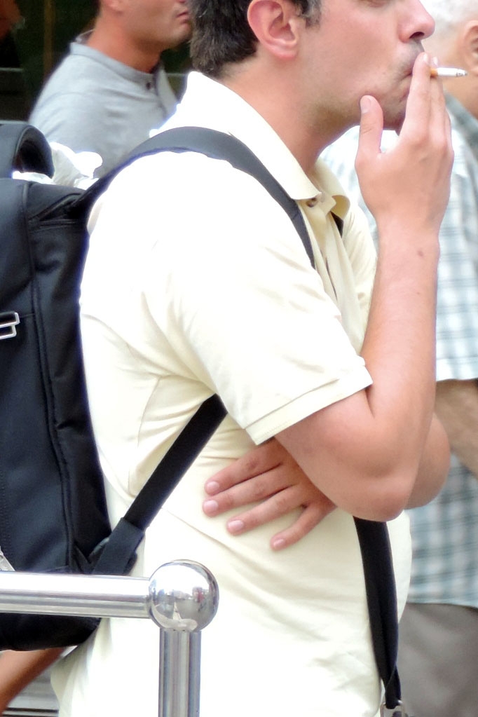 Smoking man on street