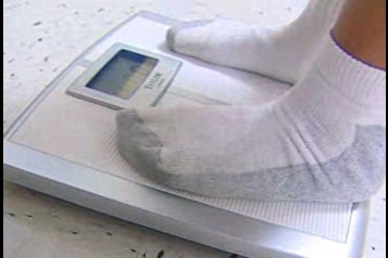 child's feet on scale
