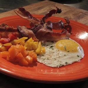 Breakfast plate - fried egg, bacon, peppers