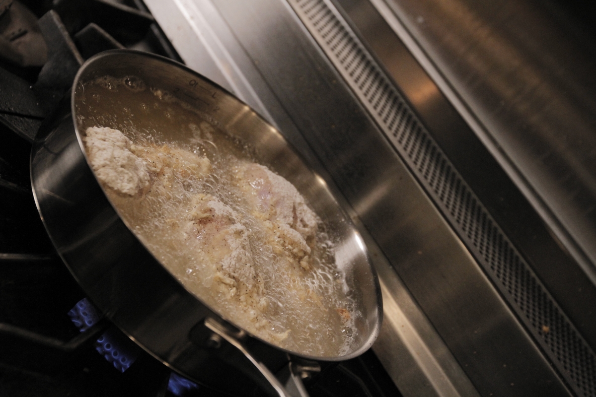 Chicken thighs frying
